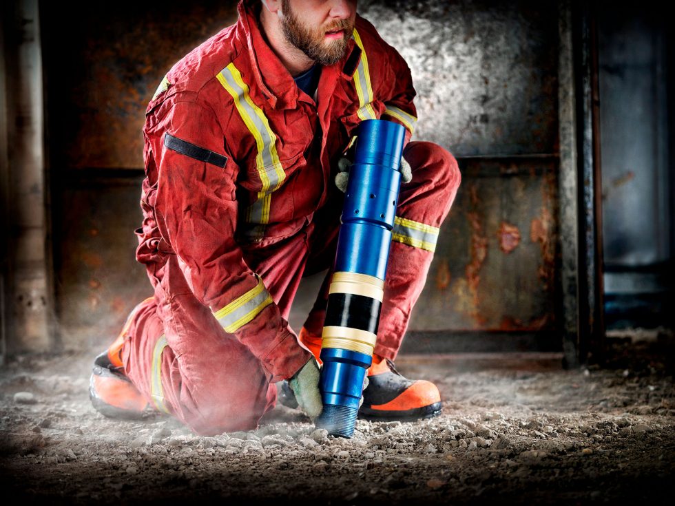 Calgary Onsite Photographer. Man onsite with steel canister.